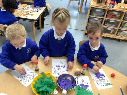 Three children decorating a turnip picture