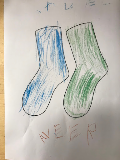 A drawing by a DPA pupil of a pair of odd coloured socks. One blue and one green to represent Anti-Bullying Week.