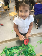 Little Birds learning about the importance of Remembrance Day. They made poppies from red paper circles and pipecleaners to add to the field made of tissue paper.