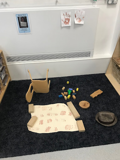 A photo of an imitation crime scene that has been created by staff in the Nursery classroom to assist in the pupils' learning about Police.