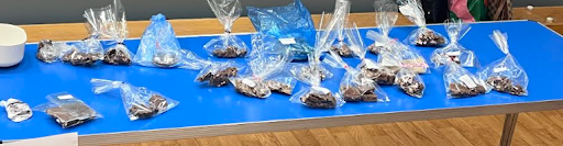 A photo showing a variety of sweet treats laid out across a table, ready to be sold by Dartford Primary pupils to other pupils.