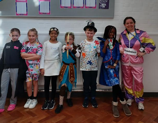 A group of DPA students are pictured smiling for the camera, whilst wearing their fancy dress outfits on World Book Day 2024.