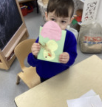 A child using arts and craft supplies for Easter creations